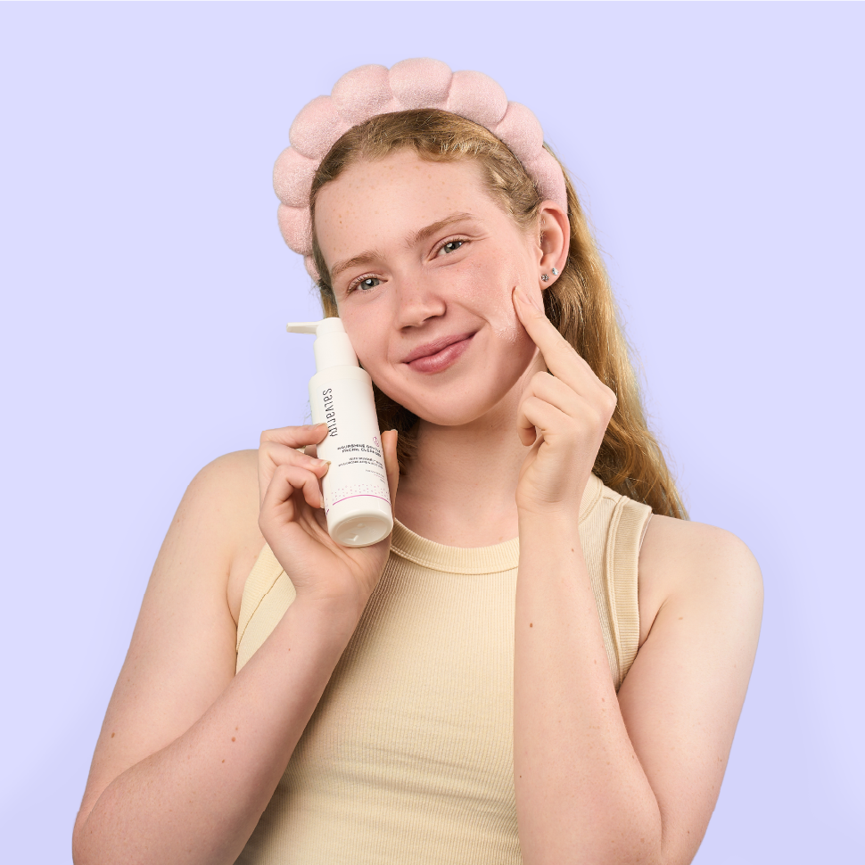 A smiling teenager girl with Salvarity AquaShine Gentle Facial Cleanser